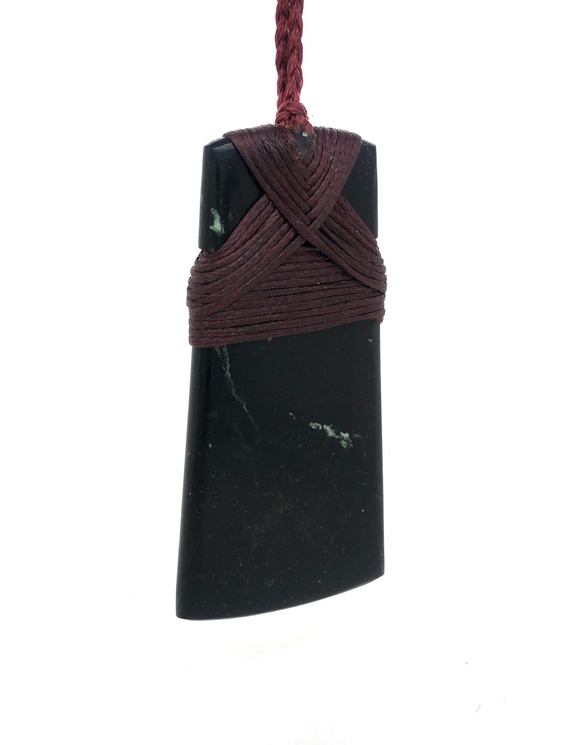 Greenstone toki pendant on red cord_0